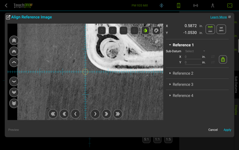 Fig. 3: The first corner zoomed in and locked at X0 Y0, with the image inverted and the color removed Zoomed grayscale inverted photo with the crosshair circled in orange and Reference 1 locked green at X0 Y0