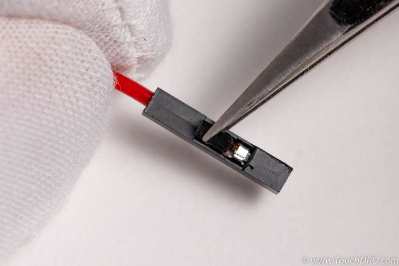 Wire housing can be removed by lifting the tab with sharp tweeers or even a large needle